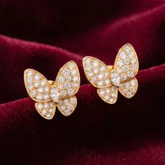 Van Cleef & Arpels, Two Butterfly earrings Gold Filled